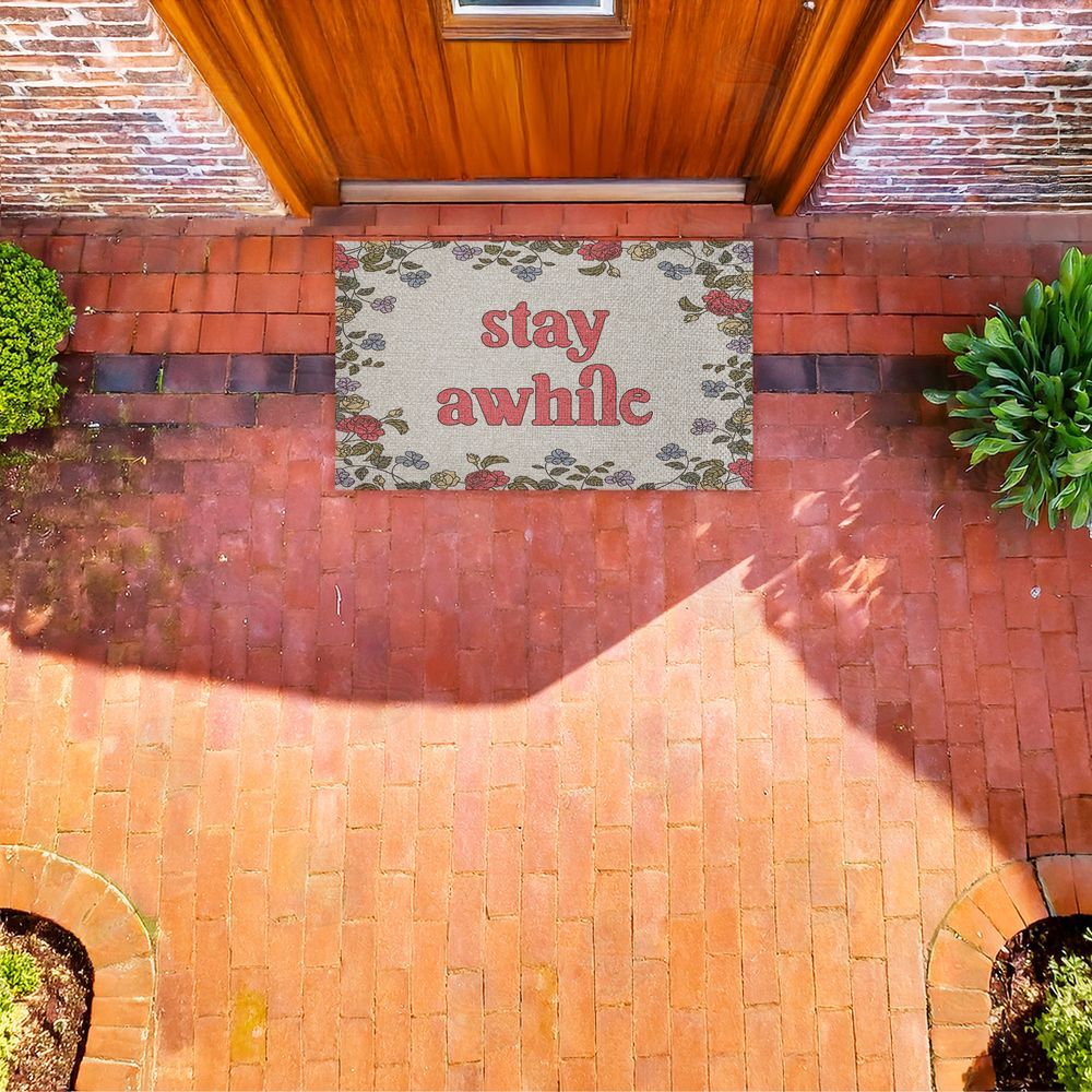 Stupell Studio | Stay Awhile Inviting Florals Faux Sisal Door Mat